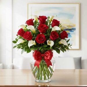 Los arreglos de alcatraces y rosas rojas son la máxima expresión de elegancia y pasión. Los alcatraces, símbolo de pureza y distinción, se combinan con la intensidad de las rosas rojas, que representan amor profundo y emociones sinceras.